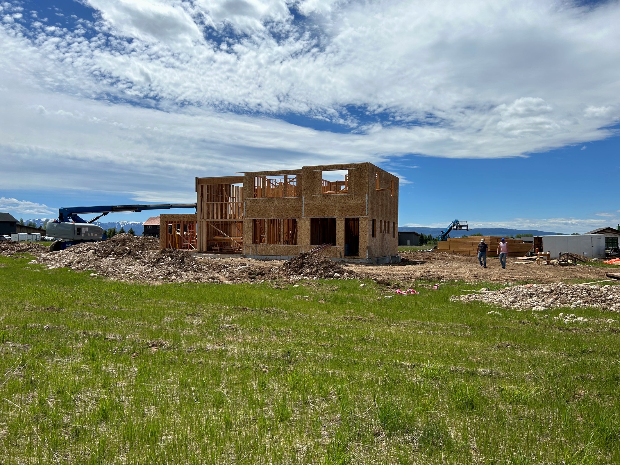 Active framing with a crane on a SwagerBuilds custom home in Driggs, Idaho. How to protect yourself in a custom home contract.