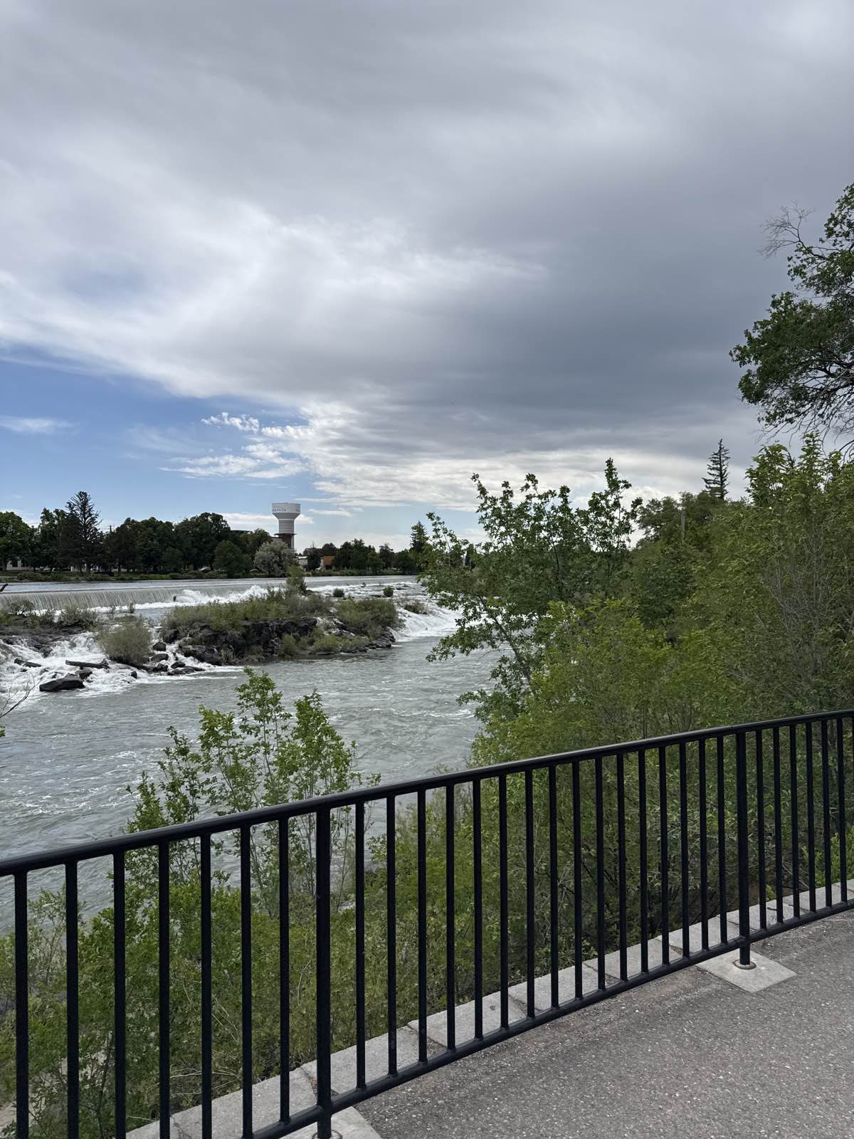 Aerial view of the Snake River and the Falls in downtown Idaho Falls, Idaho. Captured June 2026.