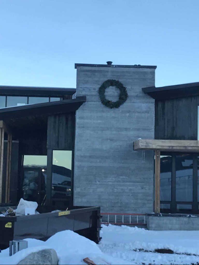 wreath on cement wall of home under construction